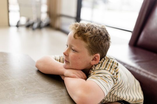Seven Year Old Waiting in Hotel Lobby in Phoenix, Arizona