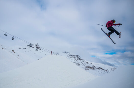 freestyle skier jumping over ramp in Scuol / Switzerland