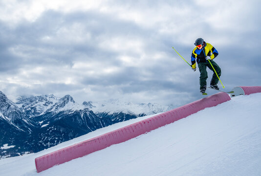 freestyle skier jumping over ramp in Scuol / Switzerland