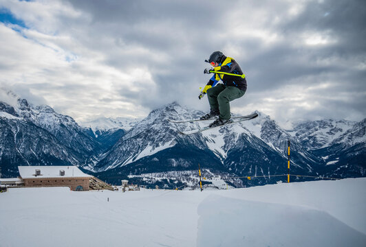 freestyle skier jumping over ramp in Scuol / Switzerland