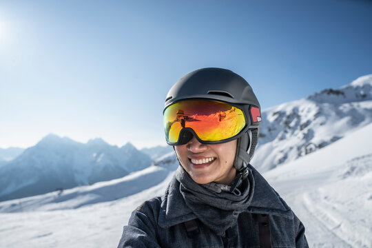 portrait of woman wearing ski googles at Scuol winter sport area