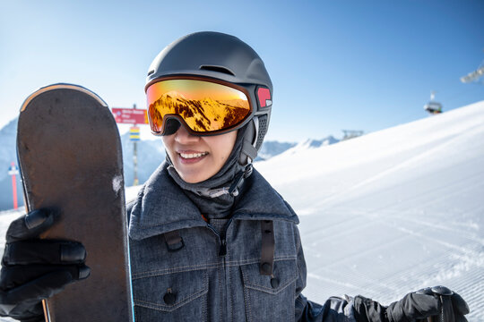 portrait of woman wearing ski googles at Scuol winter sport area