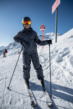 portrait of woman wearing ski googles at Scuol winter sport area