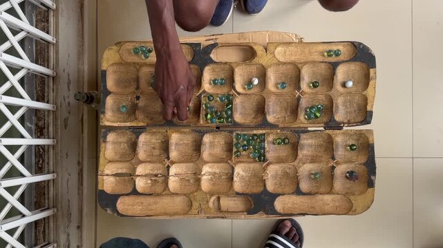 Top down view to the bawo board. Bawo is a traditional Malawian game.