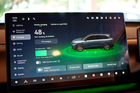 Penang, Malaysia - Apr 07, 2026: A close-up view of the large central touchscreen display in a Leapmotor C10 electric SUV, showing the vehicle charging interface and battery status at 48 percent.
