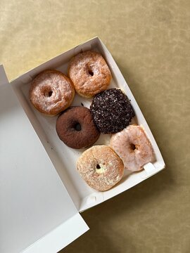 A box of doughnut or donuts or donat on brown background
