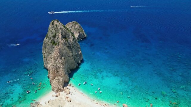 Spectacular view of Mizithres sea stacks and white limestone cliffs in Zakynthos. Crystal turquoise water and dramatic coastline of the Ionian Sea in a scenic Greek island landscape.