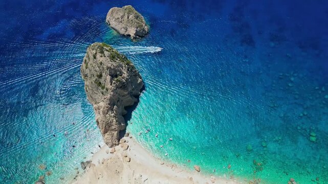 Spectacular view of Mizithres sea stacks and white limestone cliffs in Zakynthos. Crystal turquoise water and dramatic coastline of the Ionian Sea in a scenic Greek island landscape.