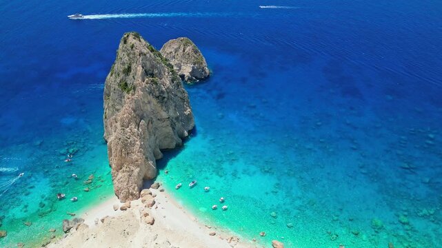 Spectacular view of Mizithres sea stacks and white limestone cliffs in Zakynthos. Crystal turquoise water and dramatic coastline of the Ionian Sea in a scenic Greek island landscape.