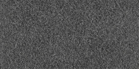 Fototapeta premium A dark, closeup wallpaper of a rough black fabric and leather texture background featuring a grimy, stone-like surface pattern similar to aged asphalt or a gray bitumen pavement backdrop