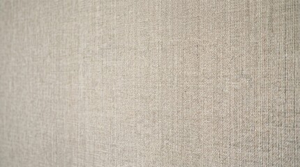Fototapeta premium Soft Fabric Wall Texture with Subtle Weave Pattern in Warm Neutral Tones
