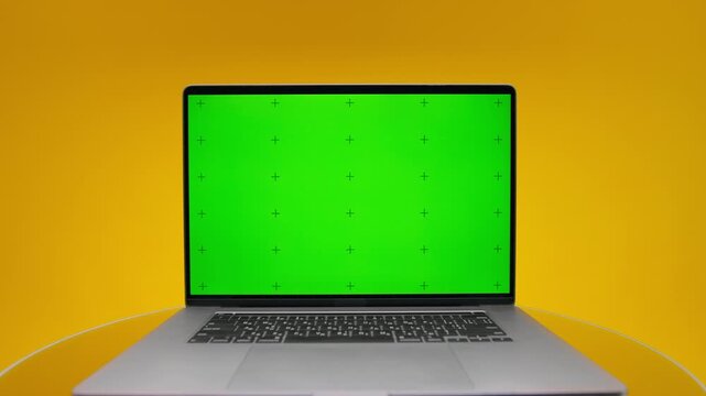 Laptop Green Screen Pack Shot on Yellow