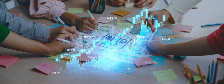 Diverse individuals work together in a collaborative environment, analyzing charts and data visualizations while surrounded by sticky notes, creating a vibrant, productive atmosphere. Scalp