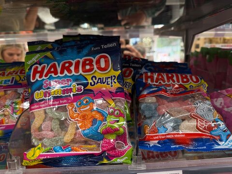 Palma, spain, may 2, 2026, haribo super wimmis and stripes gummy candies displayed on a supermarket shelf, offering familiar sweet treats
