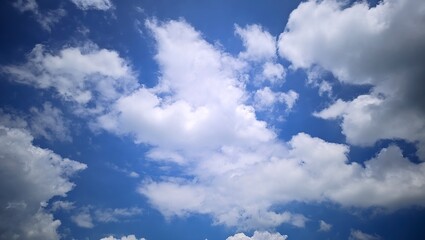 Fototapeta premium Bright Blue Sky with Fluffy White Clouds Summer Day Background