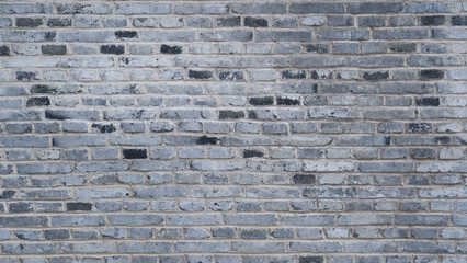 Gray brick wall texture forming rustic background © zhikun sun