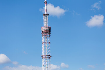 High metal antenna on blue sky background. Communication tower with many receivers and transmitters on it © Volodymyr Shcherbak