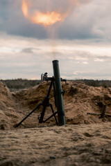 Naklejka premium The moment of the mortar fire, on the river bank.