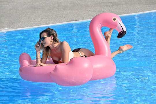 Beautiful woman in the swimming pool