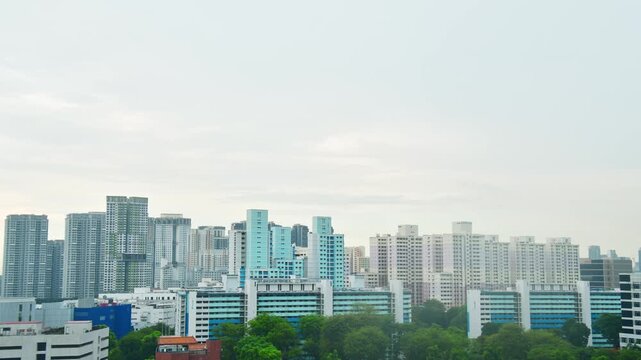 Panoramic view Skyline of residential high-rise buildings in Singapore. Blue and white HDB flats and modern apartments showcase urban density and planning in the heartlands
