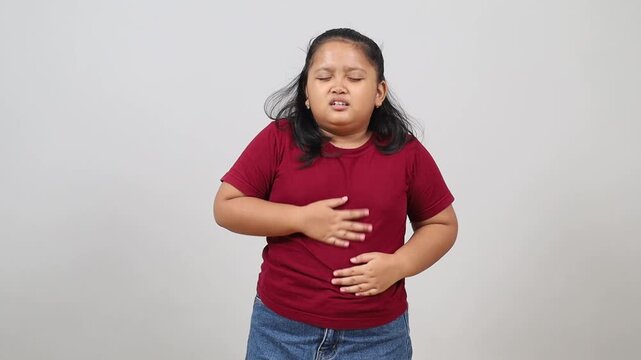 Child with a stomach ache holding belly, Abdominal pain, Showing the pain and discomfort of a stomach ache in children