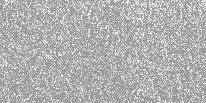 Gray background with a dense pattern of fine white irregular lines resembling grass or static texture