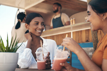 Naklejka premium Friends, happy and smoothie outdoor by food truck for wellness, bonding or weekend break. Women, smile and talking for gossip, healthy drink or beverage as small business customer and hangout