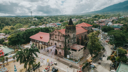 Aerial Perspective of Majayjay Church and Town in Laguna, Historic Saint Gregory Parish with Red Roofs and Mount Banahaw Background, Philippines Heritage Site View © Gids Stories