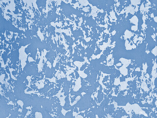 Fototapeta premium Hand-applied mediterranean blue two-color wall plaster with sponge cloudy effect, interior design background. Available in different colors