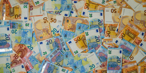 Fototapeta premium Scattered Euro Banknotes of Various Denominations