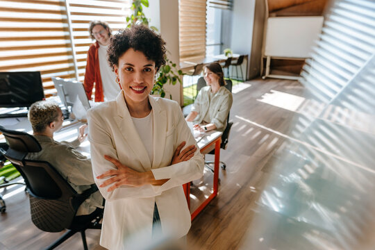 Confident businesswoman looking at camera in a modern office
