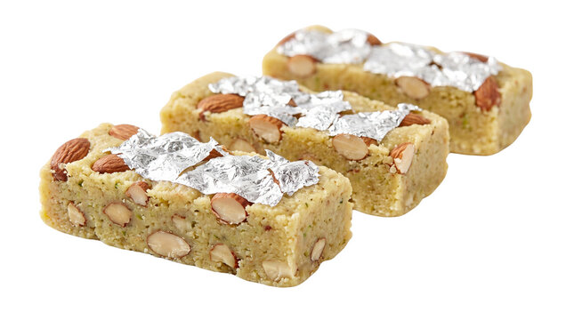 Traditional Indian almond barfi with silver leaf, sweet almond fudge pieces, festive nutty dessert snacks with vark and sliced nuts isolated PNG with Transparent Background