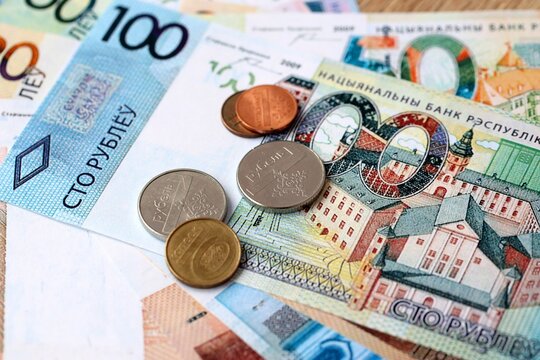 Belarusian ruble money bills and coins on table. Belarus cash of BYN currency close up