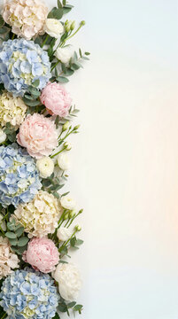 Vertical flat lay of blue hydrangeas and pink peonies on a white background. Elegant floral side border. Copy space for text