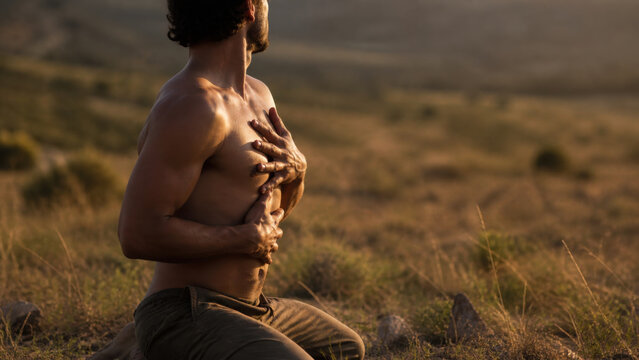 Man engages in somatic healing while connecting with nature in serene landscape, expressing deep emotions and inner peace