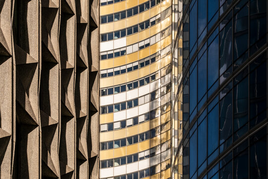 Set in paris la defense the architecture facade balances texture glass contrast and pattern to express abstract geometry across a refined exterior