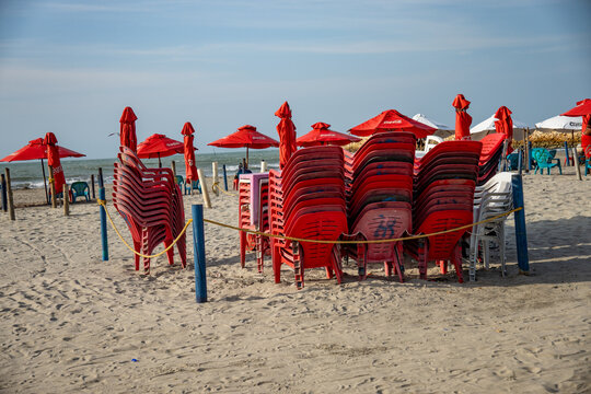 Plastic chairs piled on the beach in the Bocagrande area of Cartagena, Colombia
