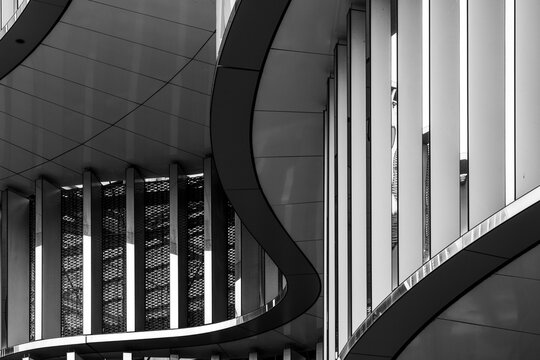 Black and white curves with lines shape architecture facade in modern pattern creating an abstract background for minimalist design layouts