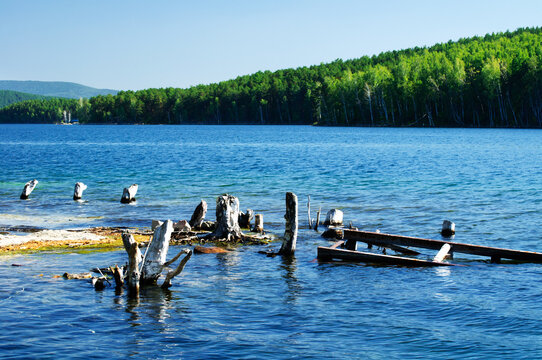 Summer sunny landscape of the Turgoyak Lake and the coast of St Faith Island in Southern Urals in sunny weather