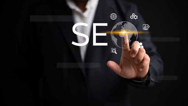 Businessman pointing at SEO icon showing search bar on virtual screen. Search optimization concept. Modern technology for searching information. Search engine optimization of your website.