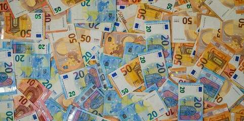Fototapeta premium Assorted Euro Banknotes Spread on White Background