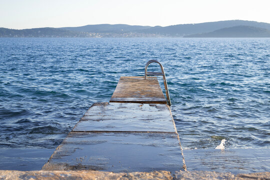 Rustic Wooden Pier with Swimming Ladder at Punta Bajlo, Zadar