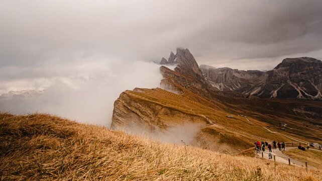 4K Time lapse of Seceda mountain peak with flowing fog and clouds in Dolomites, Italy.