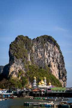 View from Phang Nga Bay of Ko Panyi, also known as Koh Panyee, a Muslim, floating, fishing village in Phang Nga Province, Thailand, notable for being built on stilts by Bugis fishermen.