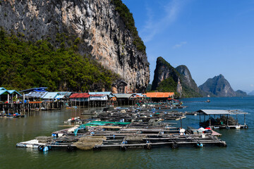 Fish farms on Phang Nga Bay, Thailand, on the shores of  Ko Panyi, also known as Koh Panyee, a Muslim, floating, fishing village, notable for being built on stilts by Bugis fishermen. © Yehoshua Halevi