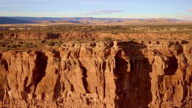 Drone footage of desert cliffs with striking red textures