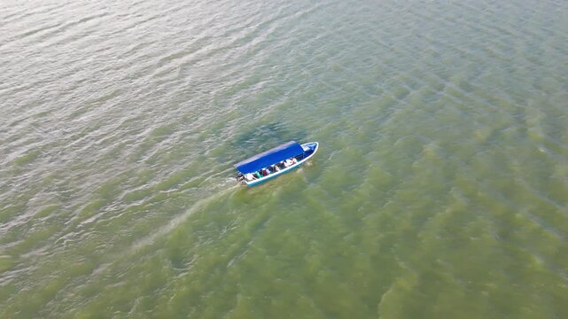 Boat travelling across lake.
Aerial drone view of  Lago Suchitlan in El Salvador. The Cerr&oacute;n Grande Reservoir, also known locally as Lake Suchitl&aacute;n