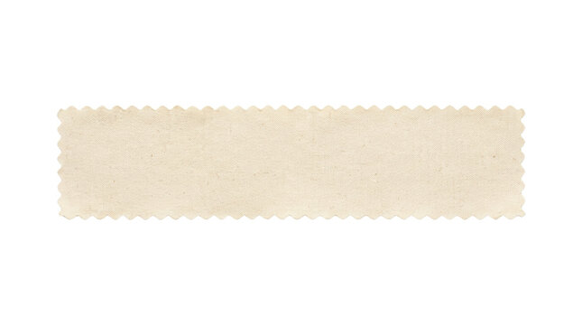 Cream canvas fabric strip top view isolated. Pinking shear textile sample.