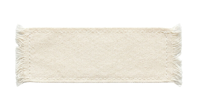 Cream woven fabric strip top view isolated. Frayed edge textile sample.