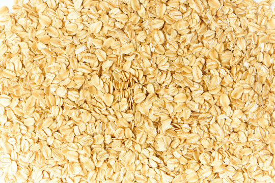 Rolled oats texture background healthy breakfast cereal concept, top view